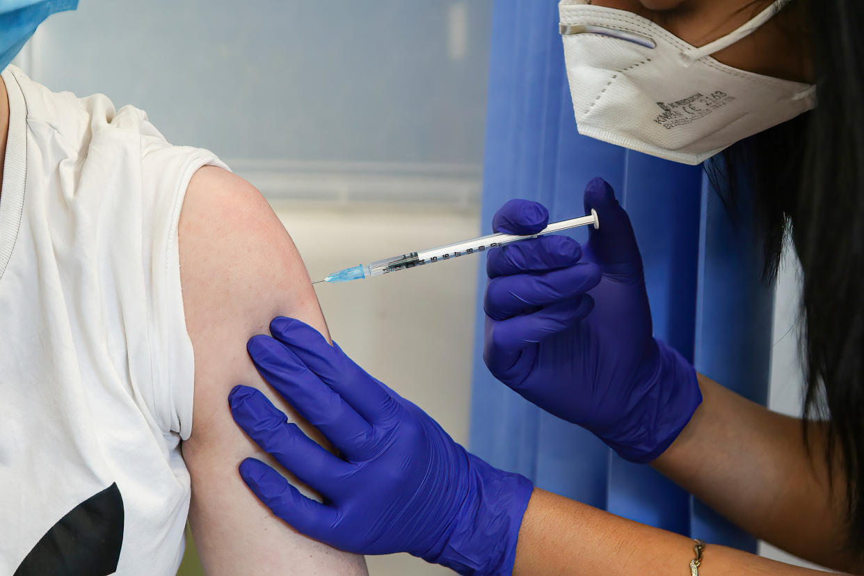 A vaccinator administers Pfizer Covid-19 vaccine to a woman at a vaccination centre. The Joint Committee on Vaccination and Immunization has refused to recommend Covid-19 vaccine for healthy children aged between 12 and 15. (Photo by Dinendra Haria / SOPA Images/Sipa USA)