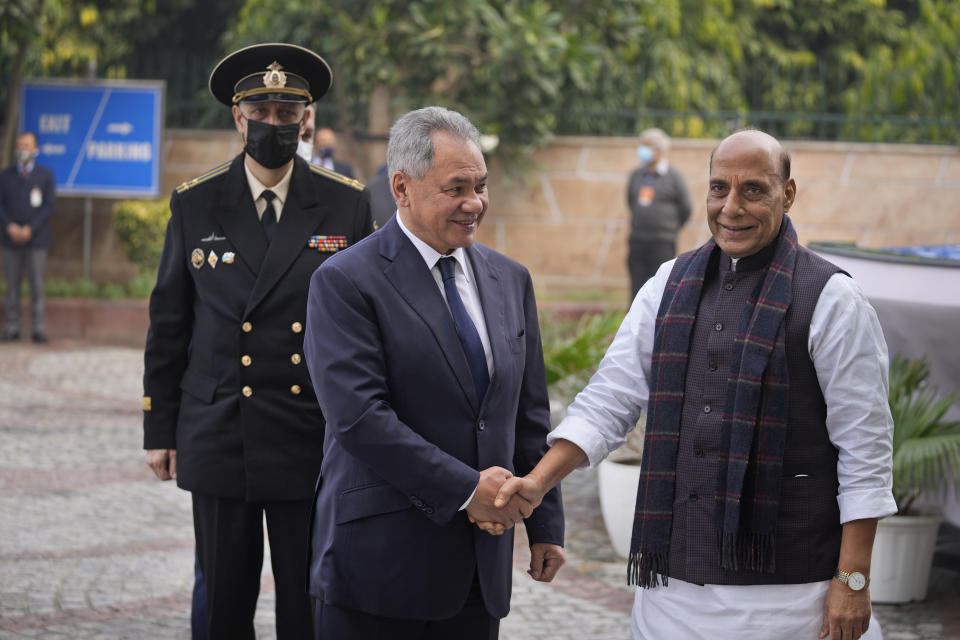 Indian Defence Minister Rajnath Singh, right, shakes hand with his Russian counterpart Sergey Shoygu in New Delhi, India, Monday, Dec. 6, 2021. Indian Prime Minister Narendra Modi meets with Russian President Vladimir Putin on Monday to discuss defense and trade relations as India attempts to balance its ties with the United States. (AP Photo/Manish Swarup)