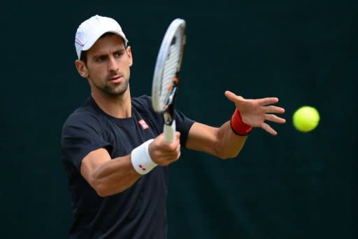 Serbia's Novak Djokovic, pictured during a practice session on Day 10 of the 2012 Wimbledon Championships at the All England Tennis Club in Wimbledon, southwest London, on July 5. Djokovic and Roger Federer have met 26 times, but Friday's potentially epic semi-final will be a first clash on grass in their rollercoaster, six-year rivalry