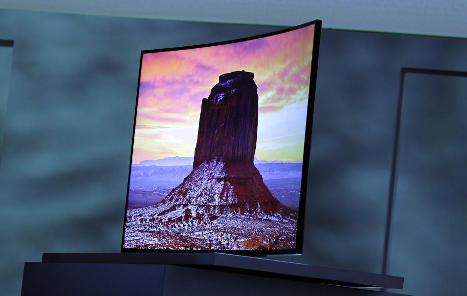 Samsung introduces an ultra high definition curved television during a news conference at the International Consumer Electronics Show, Monday, Jan. 6, 2014, in Las Vegas. (AP Photo/Isaac Brekken)