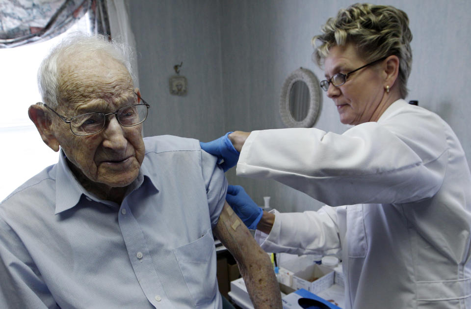 In this Tuesday, Oct. 18, 2011 photo, George Eberhardt, 107, of Chester, NJ. is given his annual flu shot by nurse Bettie Donnelly in Mendham, N.J. Babies and toddlers were more likely to get the flu vaccine last year than people over 65. Both groups are more vulnerable to flu than other age groups. Government data released Thursday, Sept. 27, 2012 also showed a wide range of vaccine protection across the country. (AP Photo/Mel Evans)