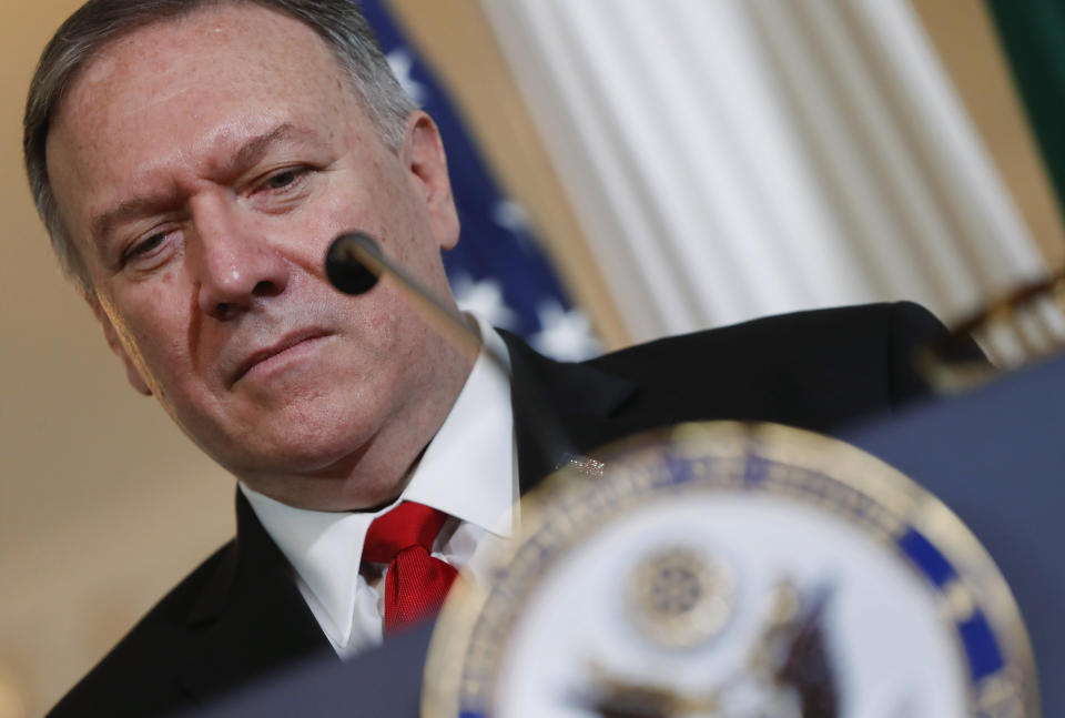 Secretary of State Mike Pompeo listens to Brazilian Foreign Minister Ernesto Araujo deliver remarks to members of the media at the Department of State in Washington, Friday, Sept. 13, 2019. (AP Photo/Pablo Martinez Monsivais)