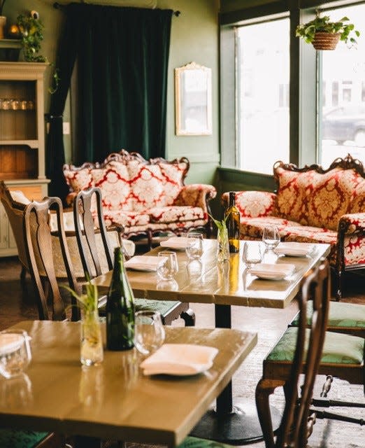 Owner Allison Meinhardt shopped locally for the antique furniture found at SAGE. She refinished the sofas and chairs to complement the restaurant's vintage-eclectic aesthetic.