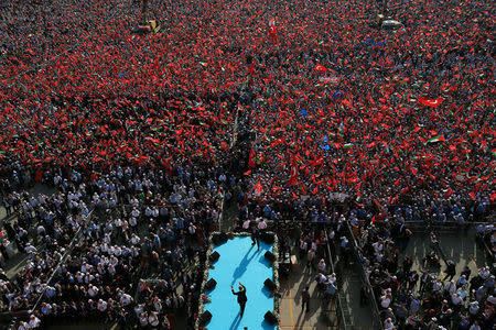 Turkish President Tayyip Erdogan greets the crowd as he takes part in a protest against the recent killings of Palestinian protesters on the Gaza-Israel border and the U.S. embassy move to Jerusalem, in Istanbul, Turkey May 18, 2018. Murat Cetinmuhurdar/Presidential Palace/Handout via REUTERS