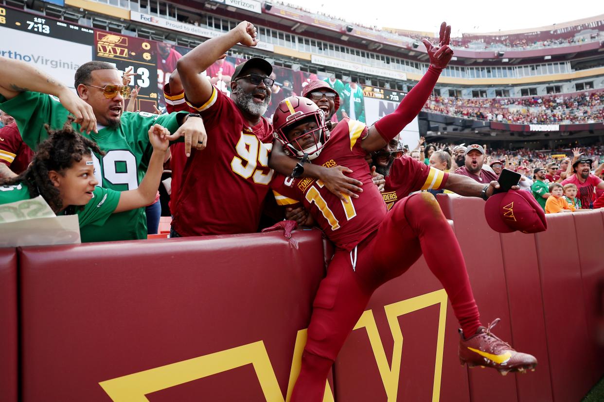 Terry McLaurin #17 of the Washington Commanders celebrates a first quarter touchdown during a game against the Philadelphia Eagles at FedExField on October 29, 2023 in Landover, Maryland.