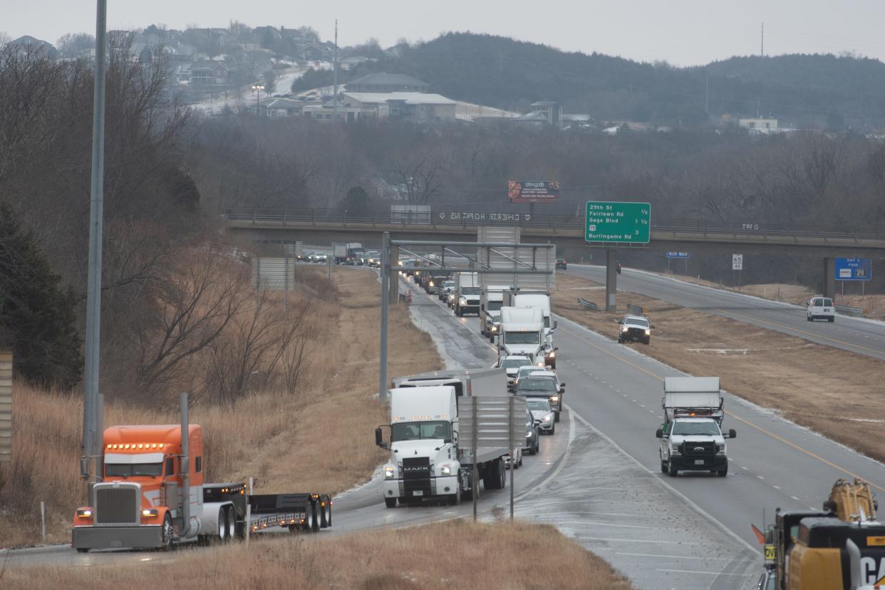 Traffic on northbound I-470 is diverted to S.W. 21st. Street after a vehicle slid off the road Thursday morning in west Topeka, striking and seriously injuring a Topeka firefighter who was on foot.