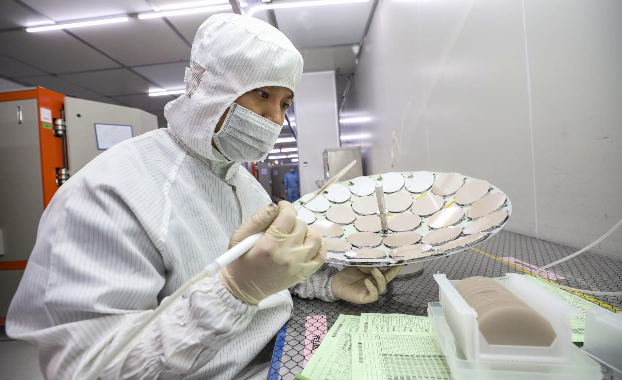 HUAI'AN, CHINA - SEPTEMBER 27: An employee works on the production line of semiconductor wafer at a factory of Jiangsu Azure Corporation Cuoda Group Co., Ltd. on September 27, 2022 in Huai'an, Jiangsu Province of China. (Photo by VCG/VCG via Getty Images)