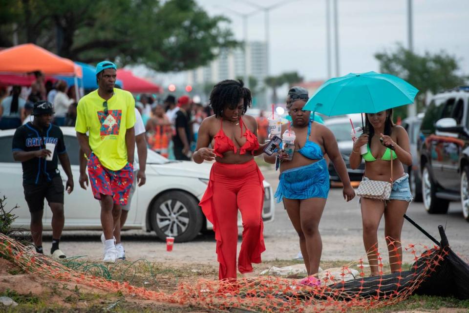 Spring breakers walk down Highway 90 next to Biloxi Beach during Black Spring Break in 2023. The mix of heavy traffic and crowds of pedestrians is a chief safety concern. Hannah Ruhoff/Sun Herald