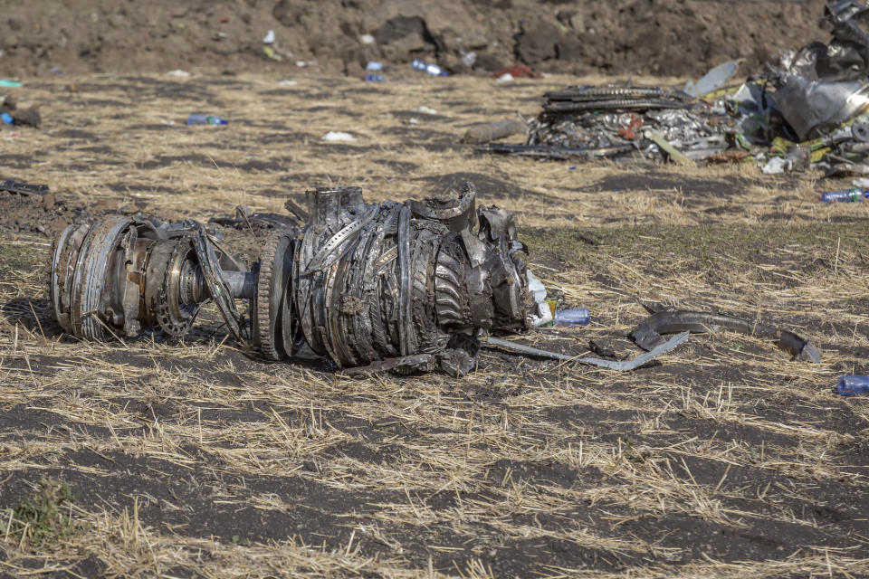 Airplane parts lie on the ground at the scene of the crash near Bishoftu. Source: AP