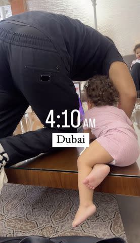 <p>Chrissy Teigen/Instagram</p> John Legend and daughter Esti Maxine at a Dubai airport during a flight delay