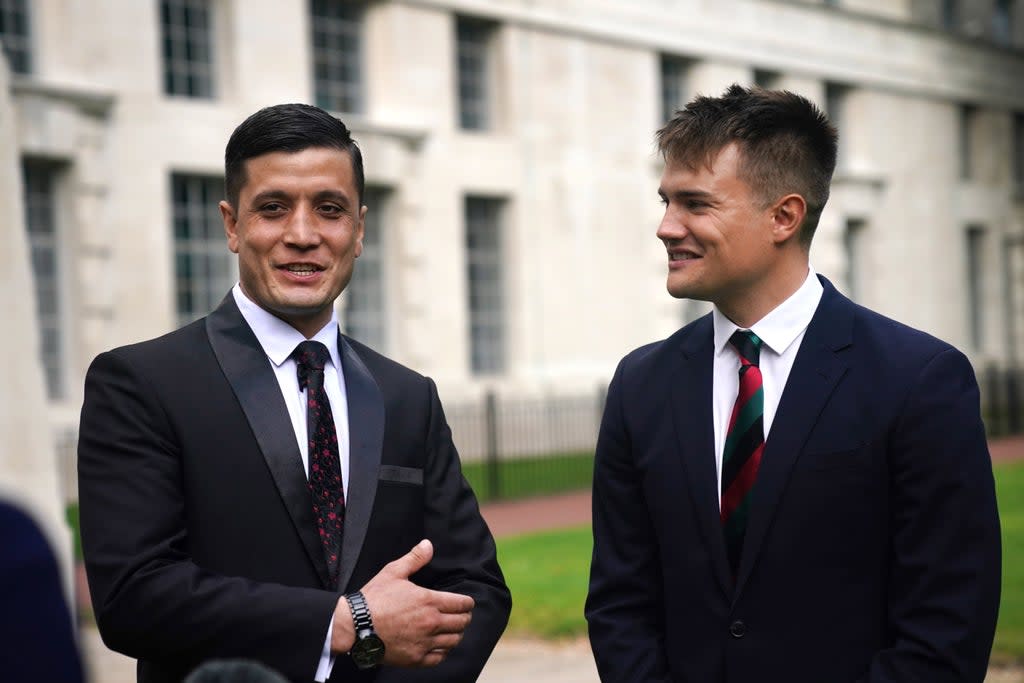 Afghan special operations officer First Lieutenant Mohammad Jawad Akbari, left, and British Army officer Captain Dave Kellett talk to each other by the Iraq Afghanistan Memorial at the Ministry of Defence building in Westminster, central London (Victoria Jones/PA) (PA Wire)