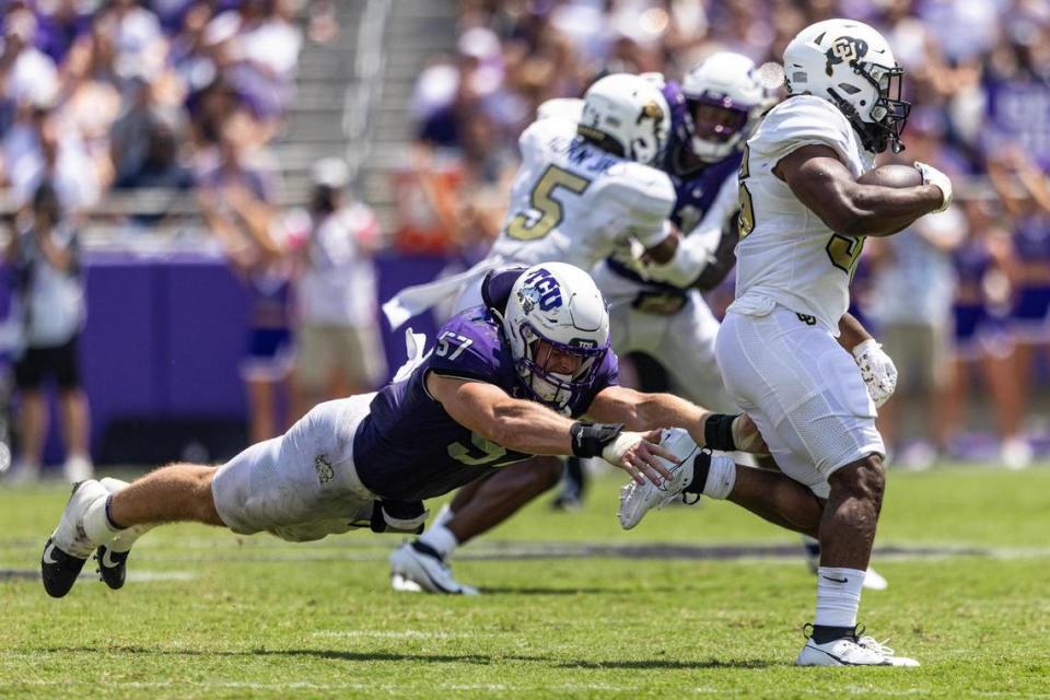 TCU linebacker Johnny Hodges (57) goes for a tackle on Colorado running back Sy’veon Wilkerson (36) during a college football game between the TCU Horned Frogs and the Colorado Buffaloes at Amon G. Carter Stadium in Fort Worth on Saturday, Sept. 2, 2023.