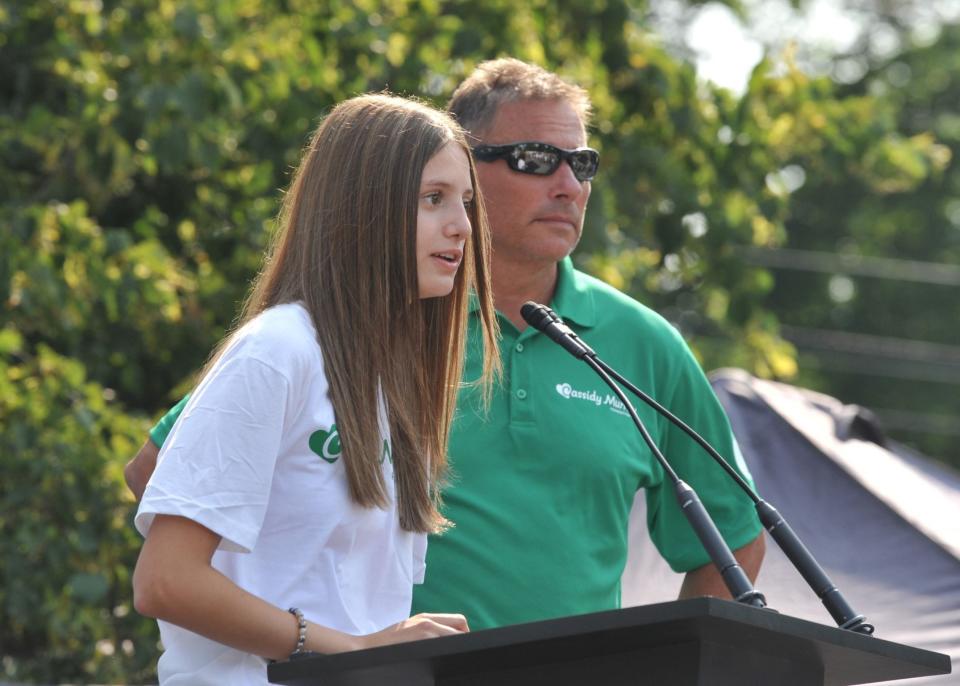 Bruce Cassidy, right, former Boston Bruins coach and current head coach of the Vegas Golden Knights, listens as his daughter, Shannon, 14, left, talks about her best friend, Cassidy Murray, who was killed last year in a boating accident in Aruba. The Cassidy Murray Foundation was launched in Milton and featured a visit by the Stanley Cup on Thursday, July 13, 2023.