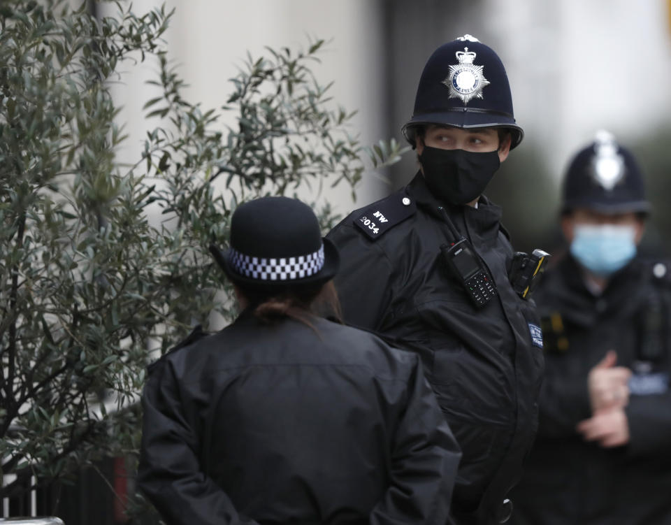 Police stand guard outside the King Edward VII hospital In London, Monday, Feb. 22, 2021, where Britain's Prince Philip is being treated. Prince Philip, 99, was admitted to the hospital on Tuesday on the advice of his doctor in what Buckingham Palace described as “a precautionary measure.” (AP Photo/Alastair Grant)