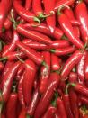 <p>You probably know this pepper more from hot sauce than the pepper itself. Tabasco peppers have a bright red color and are mashed and mixed with salt and vinegar to create a tangy hot sauce. Use the hot sauce to spice up <a href="https://www.delish.com/cooking/recipe-ideas/a20140157/nashville-hot-chicken-recipe/" rel="nofollow noopener" target="_blank" data-ylk="slk:a hot chicken sandwich.;elm:context_link;itc:0;sec:content-canvas" class="link ">a hot chicken sandwich.</a></p><p>Scoville heat units: 30,000 to 60,000</p>