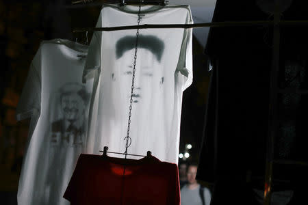 A t-shirt is displayed for sale with the image of North Korean leader Kim Jong Un ahead of the North Korea–United States Hanoi Summit in Hanoi, Vietnam February 21, 2019. REUTERS/Jorge Silva