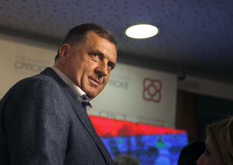 Milorad Dodik, president of the Republic of Srpska, leaves after a news conference after claiming victory in the Bosnian town of Banja Luka, 240 kilometers northwest of Sarajevo, Sunday, Oct. 7, 2018. Dodik has declared victory in the race to fill the Serb seat in Bosnia's three-member presidency. (AP Photo/Darko Vojinovic)