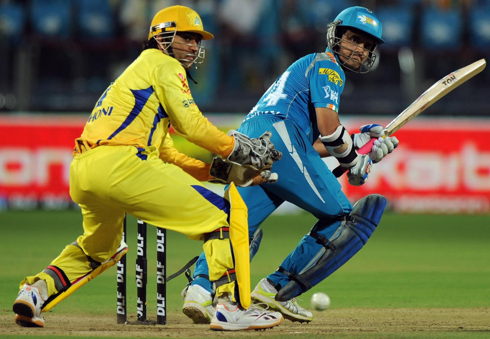 Chennai Super King captain Mahendra Singh Dhoni (L) reacts as his counterpart Pune Warriors India captain Sourav Ganguly looks back after playing a shot during the IPL Twenty20 cricket match between Pune Warriors India and Chennai Super Kings at The Subrata Roy Sahara Stadium in Pune on April 14, 2012. AFP PHOTO/Indranil MUKHERJEE RESTRICTED TO EDITORIAL USE. MOBILE USE WITHIN NEWS PACKAGE (Photo credit should read INDRANIL MUKHERJEE/AFP/Getty Images)