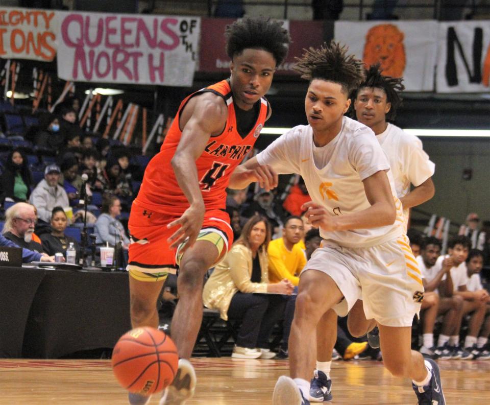 Lanphier's JaiQuan Holman wards off Southeast's Dom Hobbs during the City boys basketball tournament at the Bank of Springfield on Thursday, Jan. 26, 2023.