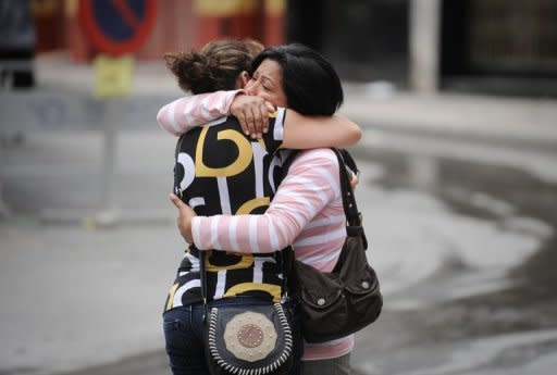 Women console each other in Lorca, southern Spain. Spain mourned on Friday the nine people killed after a 5.1-magnitude earthquake struck the historic southern city, forcing thousands to flee their homes