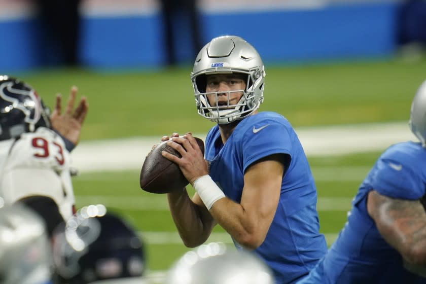 Detroit Lions quarterback Matthew Stafford looks downfield during the second half of an NFL football game.