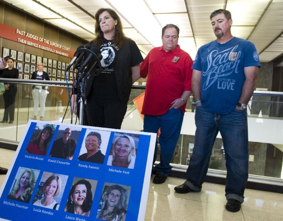 Bethany Webb addresses the media as Butch Fournier, center, and Craig Burke listen after Scott Dekraai pleaded guilty, at Orange County Superior Court in Santa Ana, Calif., on Friday, May 2, 2014. Dekraai, 44, who was in a custody fight with his ex-wife pleaded guilty Friday to killing her and seven others in a shooting rampage at a California hair salon in 2011. Dekraai donned a bulletproof vest before heading to the Seal Beach salon where his ex-wife worked as a stylist in October 2011. Authorities said he shot and killed Michelle Fournier before turning his gun on the salon's owner and spraying Salon Meritage with bullets. The salon reopened about a year later, with six of the original employees returning to work. (AP Photo/The Orange County Register, Kevin Sullivan) MAGS OUT; LOS ANGELES TIMES OUT