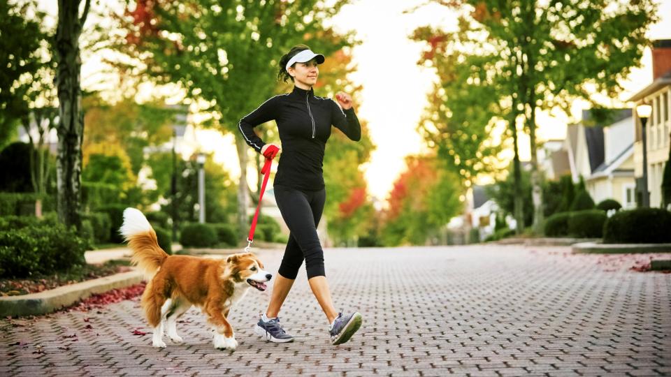 woman walking with her dog