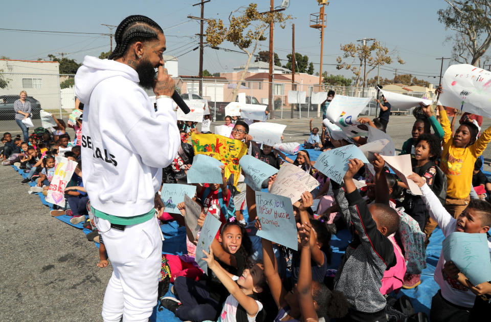 Nipsey Hussle wearing white hoodie 