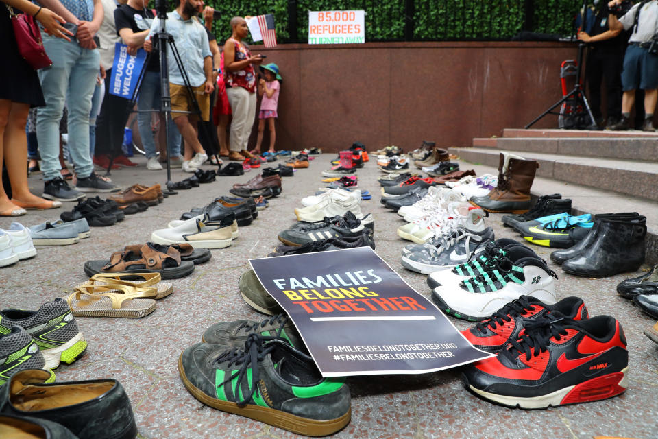 85 pairs of shoes representing 85,000 refugees excluded by the Trump administration sit in Dag Hammarskjold Plaza across from the United Nations in New York City on June 20, 2018. (Photo: Gordon Donovan/Yahoo News)