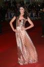 <p>Novembre 2016. Jenifer monte une fois de plus les marches du Palais des Festivals lors des NRJ Music Awards à Cannes. Elle opte pour une robe longue rose et dorée et attire tous les flashs sur elle. Crédit photo : Getty Images </p>