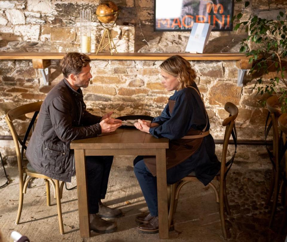 Archie and Martha sit at table on Beyond Paradise