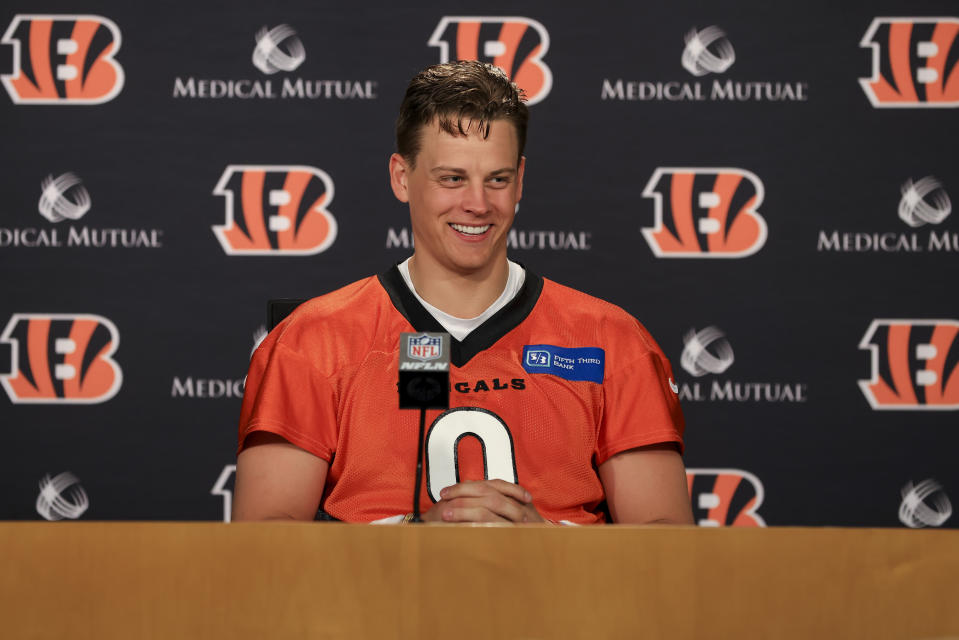 Cincinnati Bengals' Joe Burrow talks with members of the media after an NFL football practice in Cincinnati, Tuesday, May 17, 2022. (AP Photo/Aaron Doster)