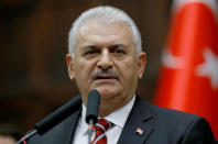 Turkey's Prime Minister Binali Yildirim addresses members of parliament from his ruling AK Party (AKP) during a meeting at the Turkish parliament in Ankara, Turkey, November 8, 2016. REUTERS/Umit Bektas