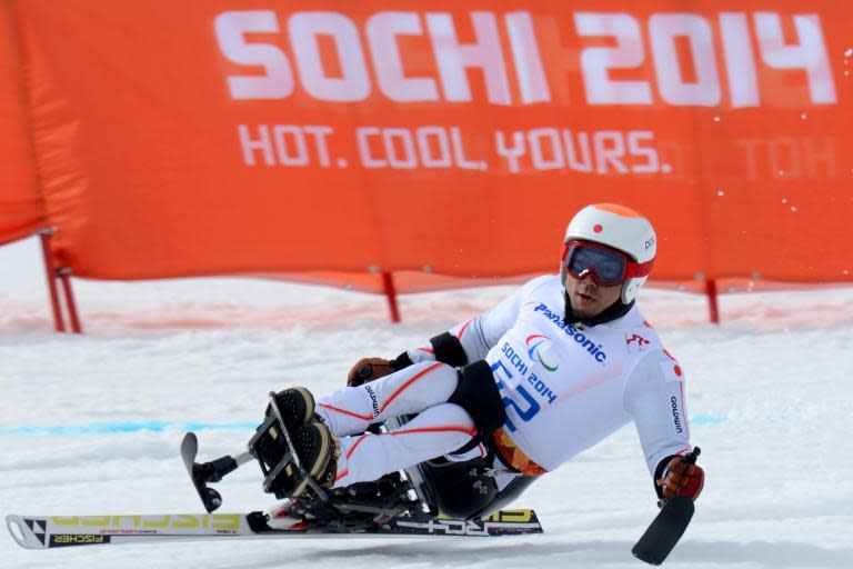 Japan's Akira Kano on his way to gold in the Men's Downhill Sitting at the Paralympic Games in the Rosa Khutor stadium near Sochi on March 8, 2014