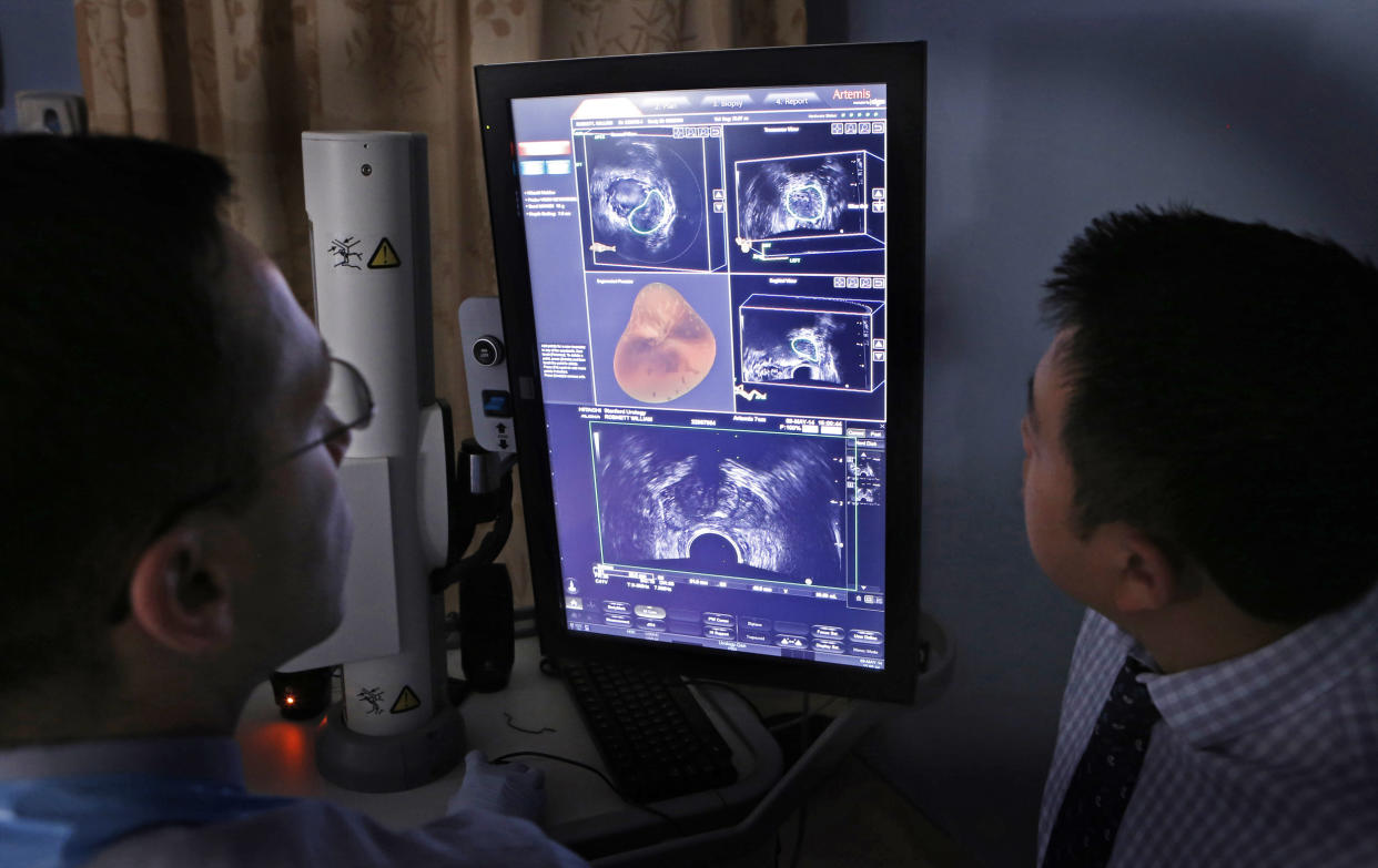 Doctors examine ultrasound and MRI images from a prostate biopsy (Michael Macor / The San Francisco Chronicle via Getty Images file)