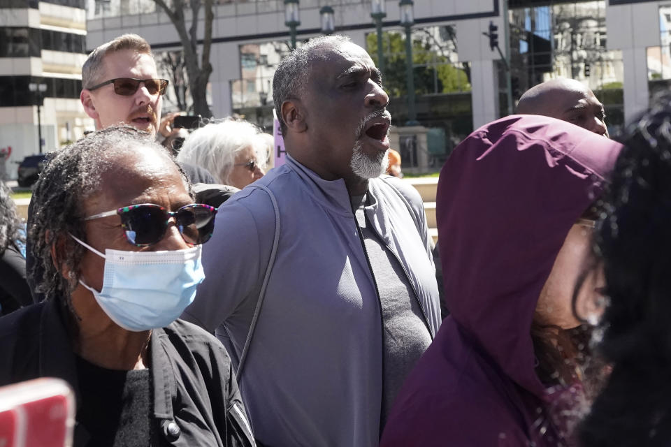 John Williams, middle, reacts to speakers at a rally calling for an end to the eviction moratorium before a special community and economic development committee by the Oakland City Council at City Hall in Oakland, Calif., Tuesday, April 11, 2023. Some landlords have gone without rental income for more than three years after Oakland approved an eviction moratorium in March 2020. (AP Photo/Jeff Chiu)