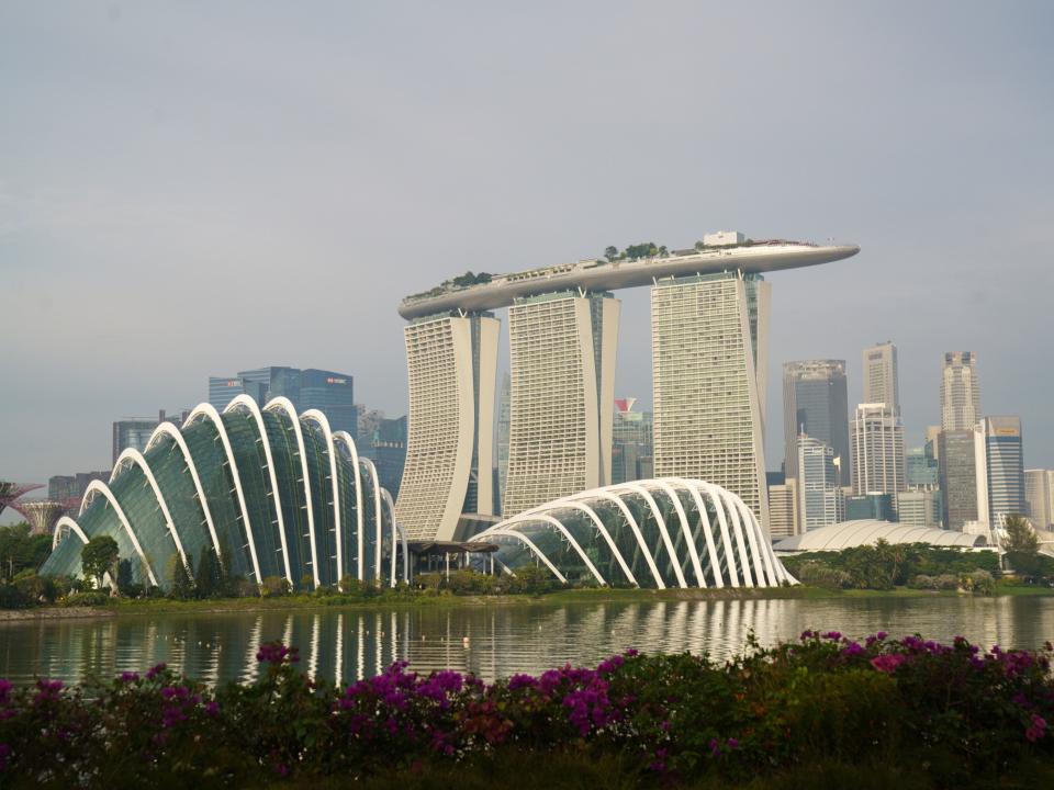 Gardens by the Bay, from left, Marina Bay Sands, and the central business district in Singapore, on Sunday, Oct. 3, 2021. Photographer: Ore Huiying/Bloomberg