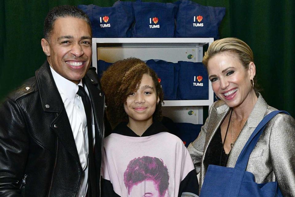 <p>Eugene Gologursky/Getty Images </p> T.J. Holmes with daughter Sabine and Amy Robach