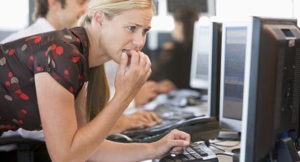 Anxious Woman Looking At Computer Monitor