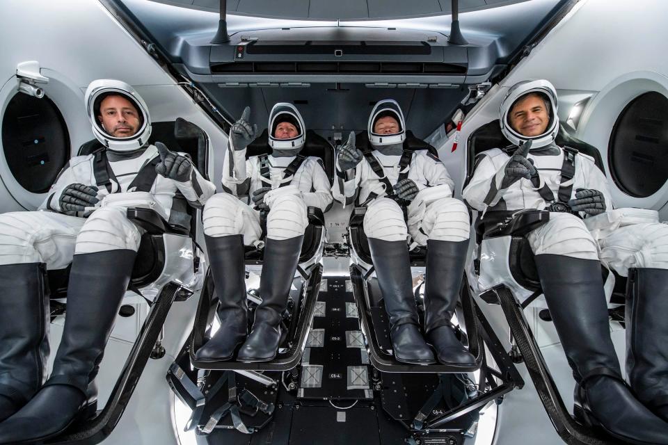 Crew members of the Axiom-1 first all-private mission to the International Space Station are seen inside of the SpaceX Crew Dragon capsule during a practice run. From left to right, Mission Specialist Mark Pathy, Pilot Larry Connor,  Commander Michael López-Alegría, Mission Specialist Eytan Stibbe.