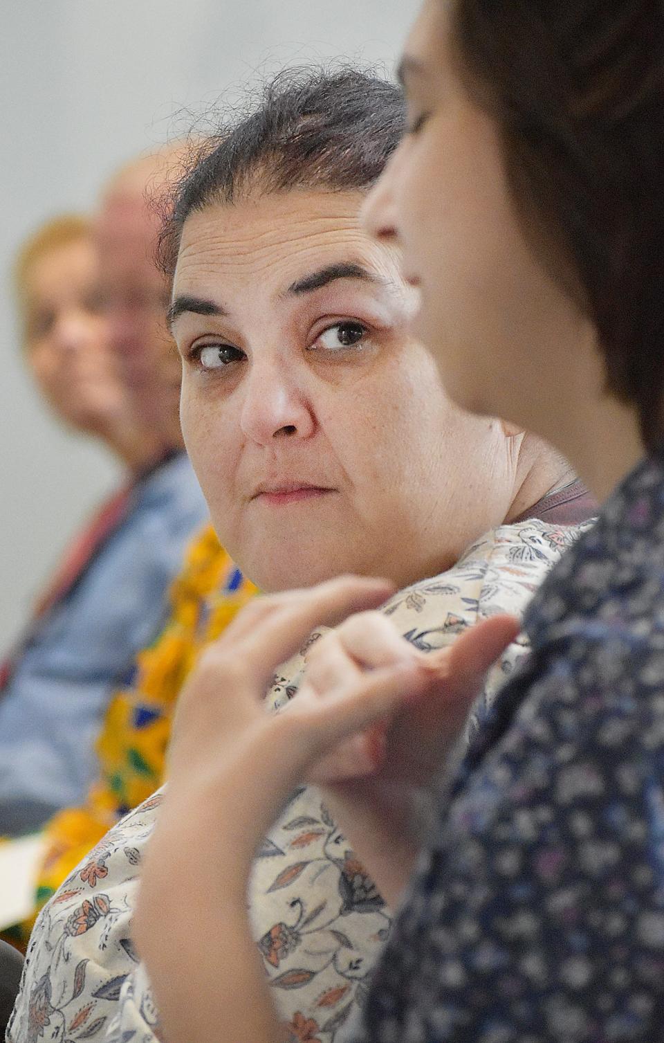 Jenna Cleveland listens as Mikayla Mello speaks at the Roundtable on Education and Workplace Priorities at Bristol Community College on Thursday, April 6. Both are Bristol CC students.