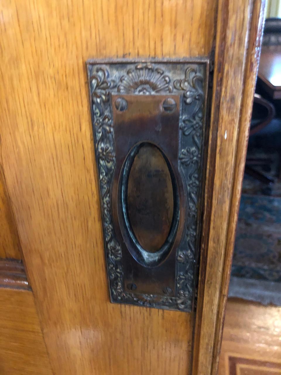 Ornate details are evident in the Bivins Home, including the inlaid wooden flooring, brass door handles and hand painted murals.