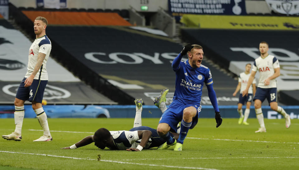 Leicester's Jamie Vardy, right reacts and celebrates after Tottenham's Toby Alderweireld, left scored an own goal for Leicester's second goal of the game during the English Premier League soccer match between Tottenham Hotspur and Leicester City at the White Hart Lane stadium in London Sunday, Dec. 20, 2020. (AP Photo/Frank Augstein, Pool)