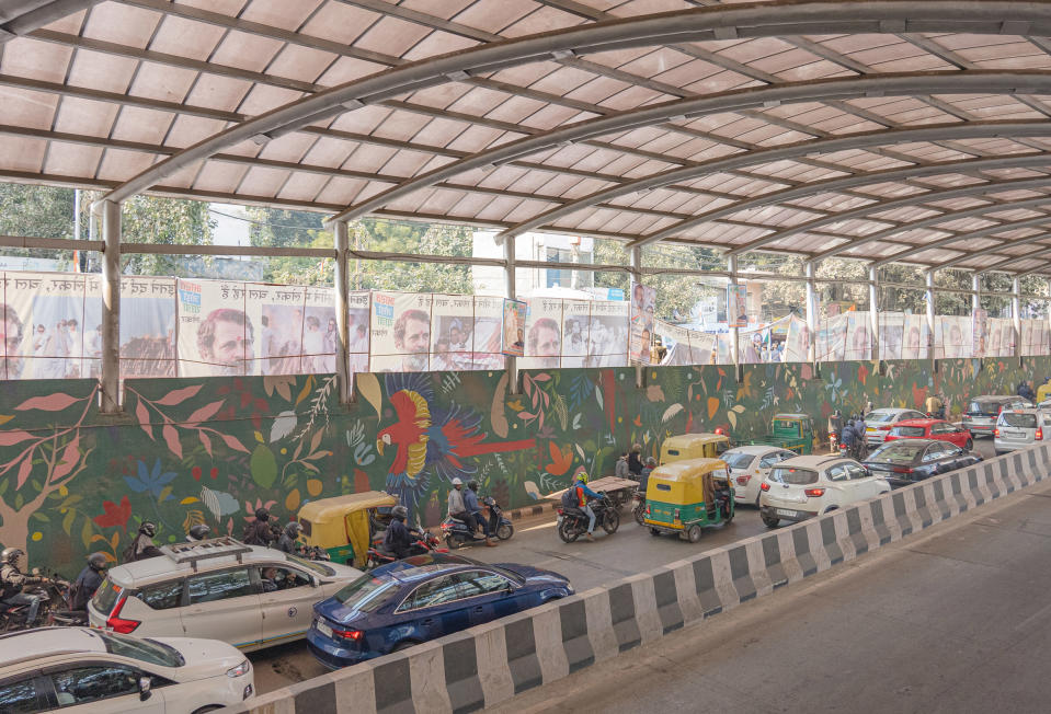 Traffic moves past posters of the Bharat Jodo Yatra, which line the streets of New Delhi, India.<span class="copyright">Ronny Sen for TIME</span>