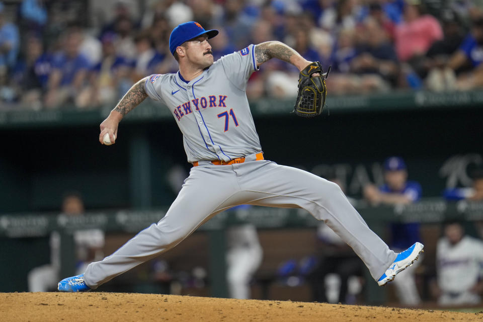 New York Mets pitcher Sean Reid-Foley throws a pitch to the Texas Rangers during the sixth inning of a baseball game, Wednesday, June 19, 2024, in Arlington, Texas. (AP Photo/Julio Cortez)