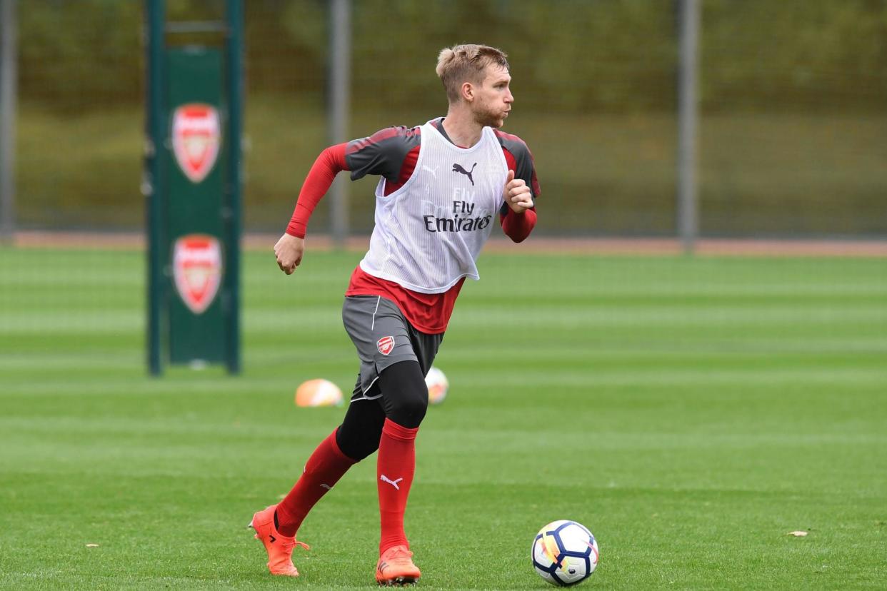 Captain | Mertesacker has predominantly taken on a pastoral role this season: Arsenal FC via Getty Images