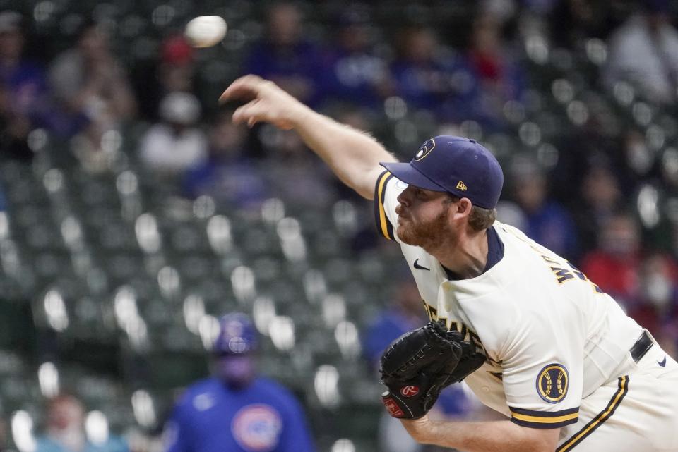 Milwaukee Brewers starting pitcher Brandon Woodruff throws during the first inning of a baseball game against the Chicago Cubs Tuesday, April 13, 2021, in Milwaukee. (AP Photo/Morry Gash)