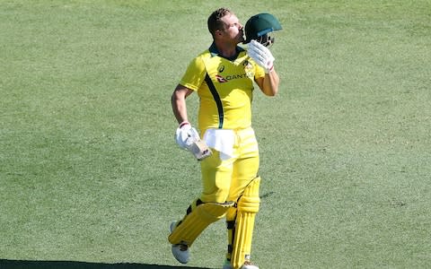 Australian batsman Aaron Finch celebrates scoring 100 during game two of the One Day International series between Australia and England at The Gabba on January 19, 2018 in Brisbane, Australia - Credit: Getty Images