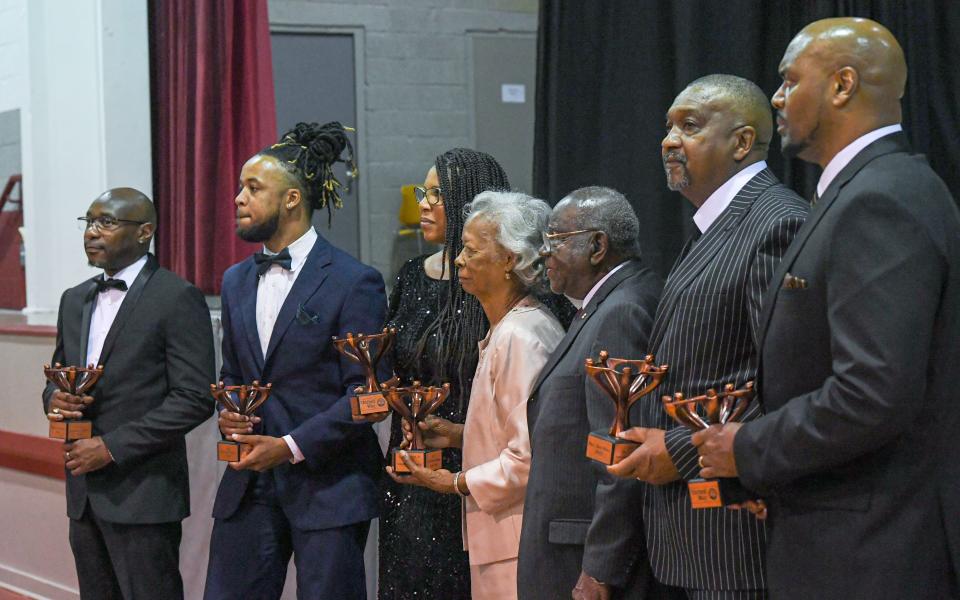 Marcus Brown, left, Cameron Owens Hunter, Crystal Noble, Margaret Reese Rucker and Jason Rucker Jr., Rev. Joe Moss, and Bobby McGowens pose for photographers as African American Leadership Society of United Way of Anderson County award recipients, during the 2024 African American Leadership Society awards at the Westside Community Center in Anderson, S.C. Friday, June 21, 2024.