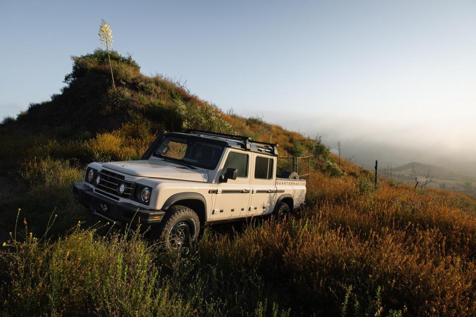 a white truck parked on a hill